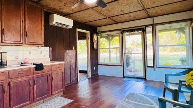 a view of an entryway with wooden floor