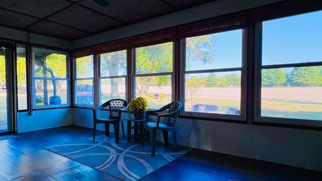 a view of a backyard with sitting area