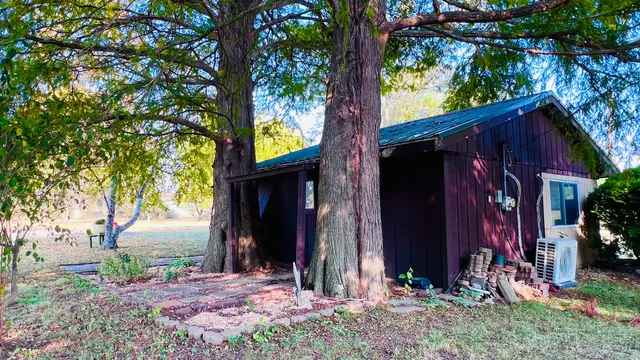 a backyard of a house with lots of green space