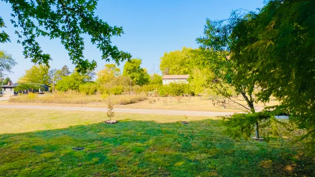 a view of an ocean and a yard
