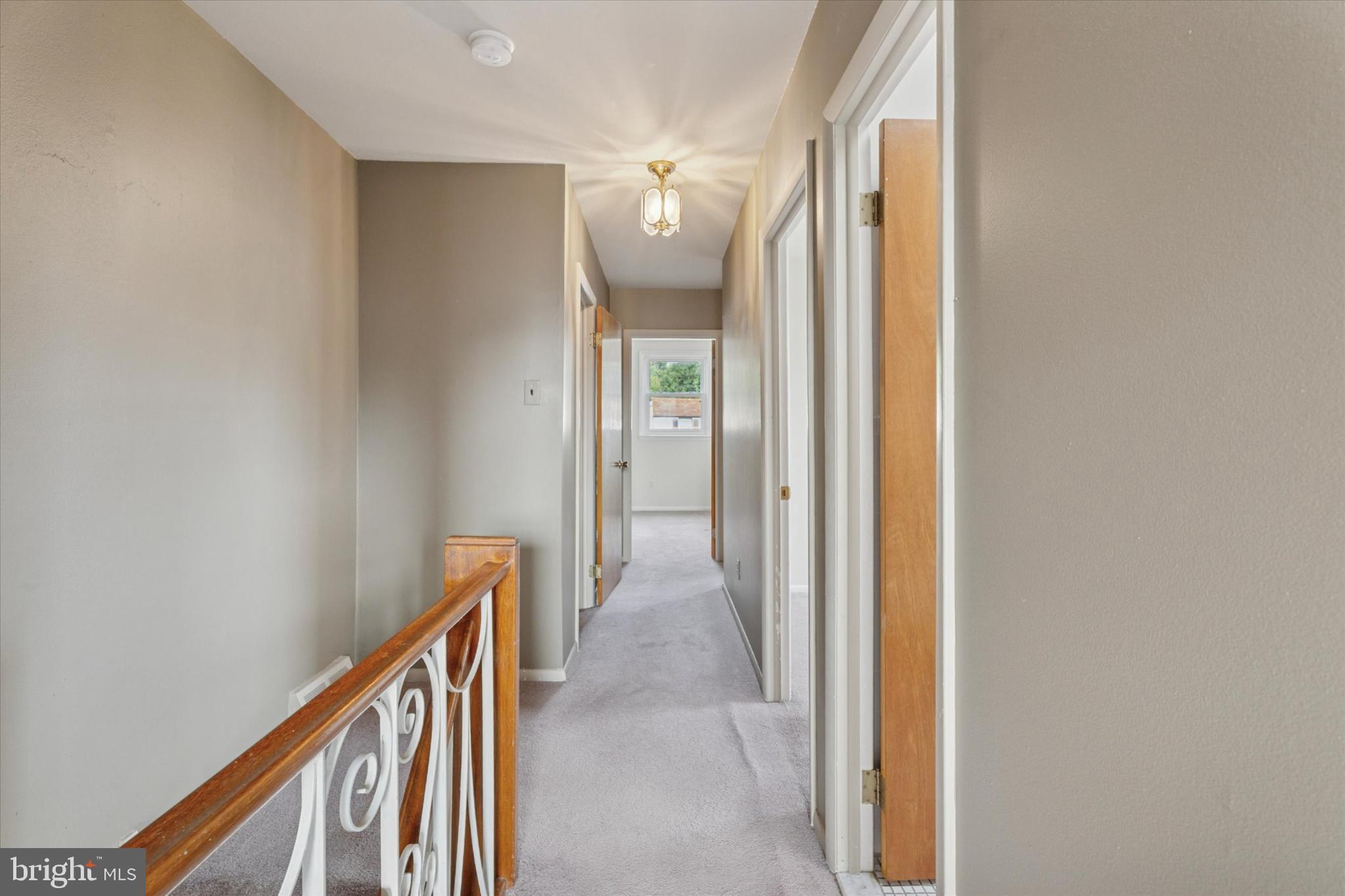 7429 Keiffer Street Philadelphia, PA 19128 - Photo 18 of 35 a view of a hallway with wooden floor and stairs
