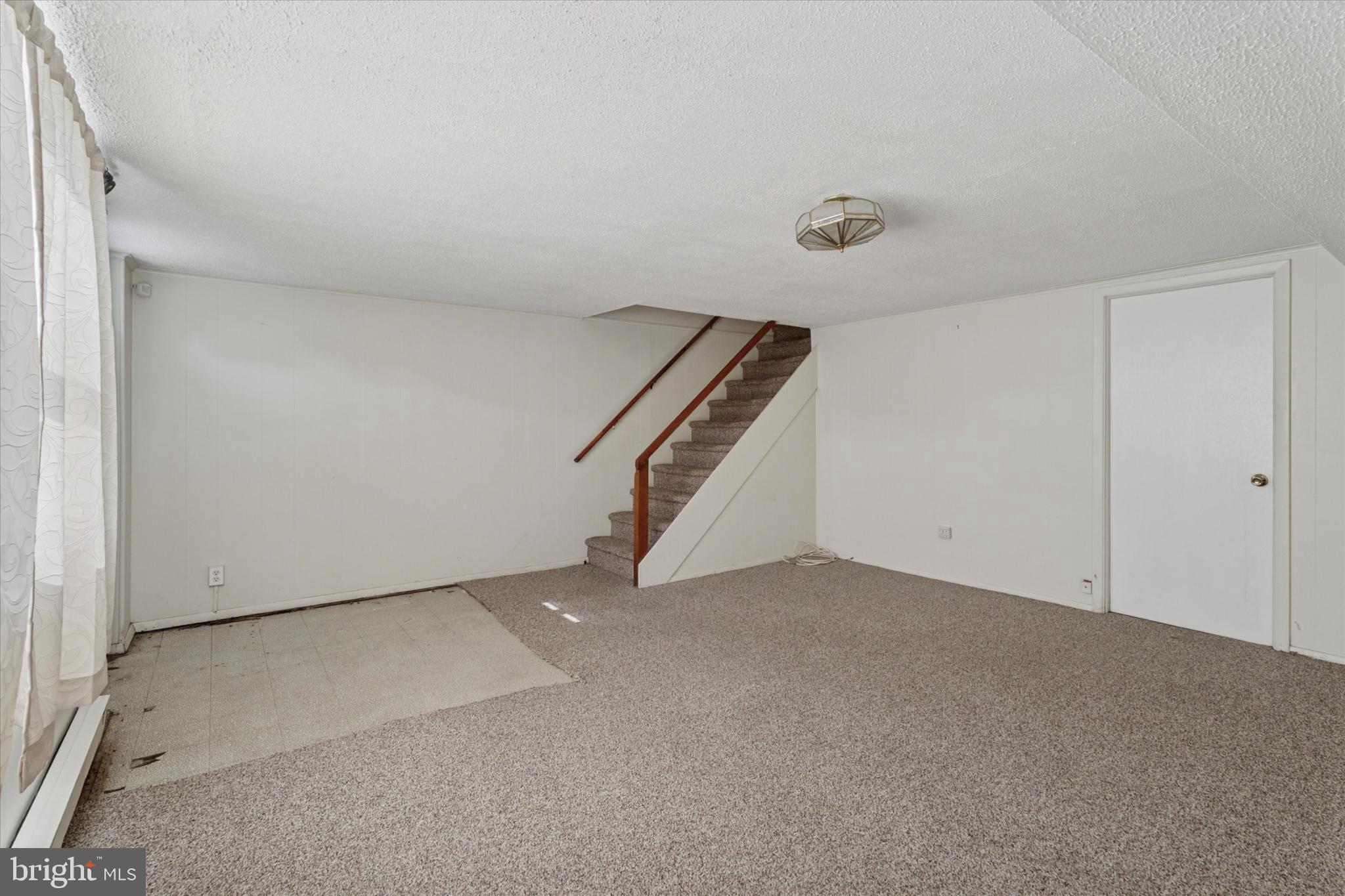 7429 Keiffer Street Philadelphia, PA 19128 - Photo 26 of 35 an empty room with staircase