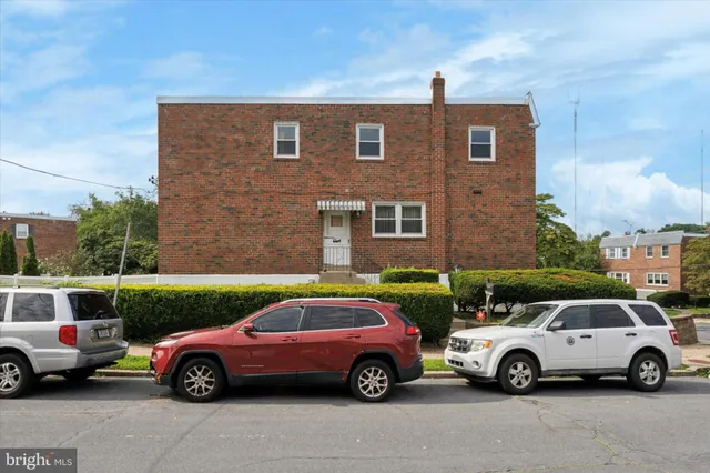 a car parked in front of a house