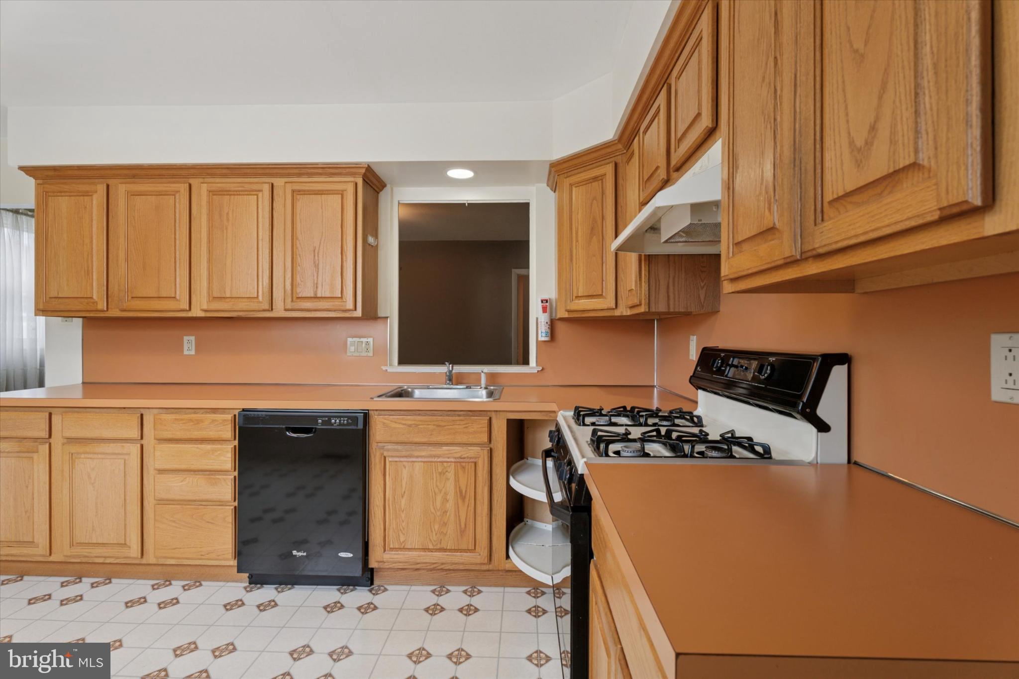 7429 Keiffer Street Philadelphia, PA 19128 - Photo 10 of 35 a kitchen with a sink a stove and cabinets