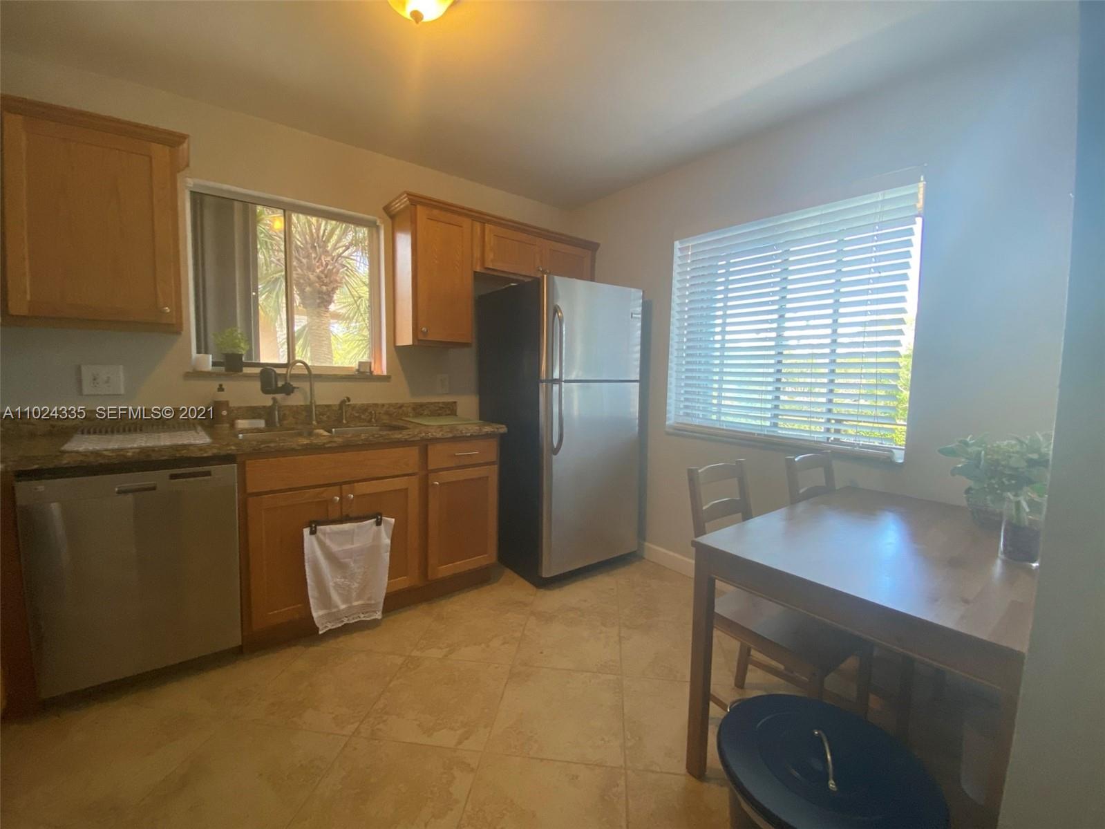 209 Lakeview Drive, Unit 202 Weston, FL 33326 - Photo 4 of 25 a kitchen with a sink cabinets and appliances