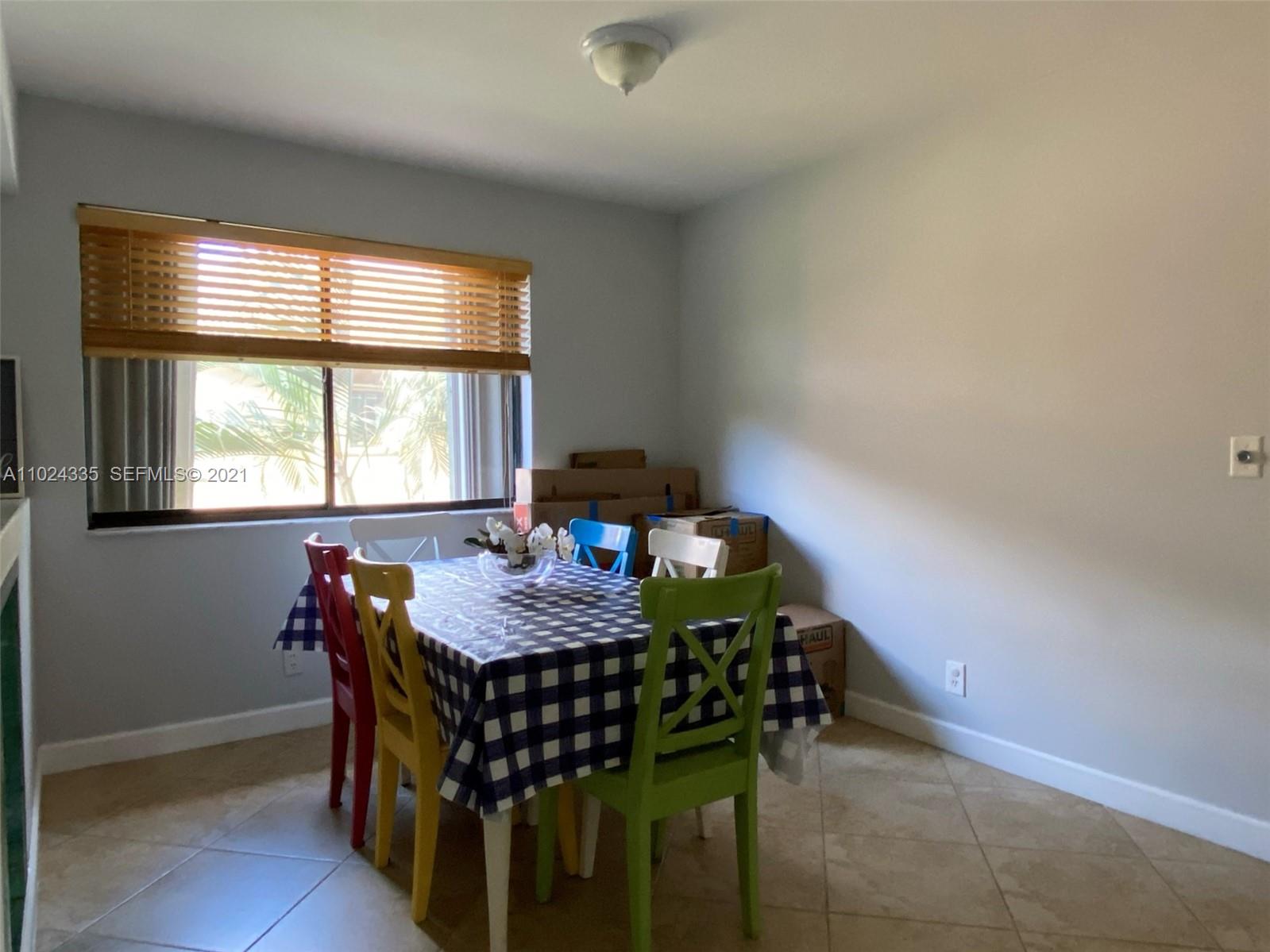 209 Lakeview Drive, Unit 202 Weston, FL 33326 - Photo 8 of 25 a view of a dining room with furniture and window