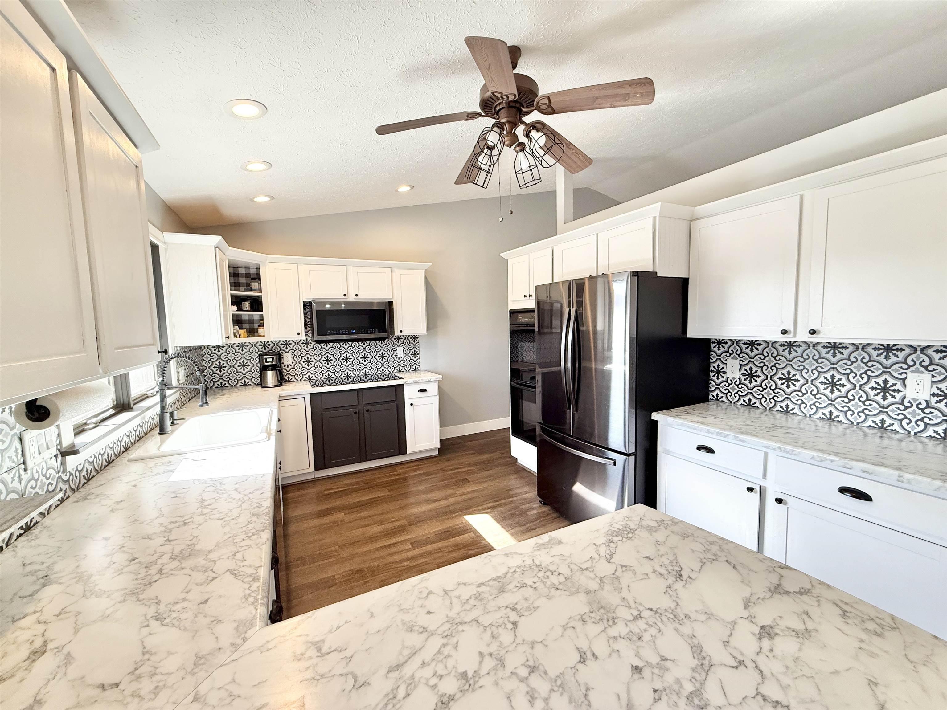 11245 Fox Trail Road Durand, IL 61024 - Photo 11 of 56 a kitchen with granite countertop a refrigerator and a sink