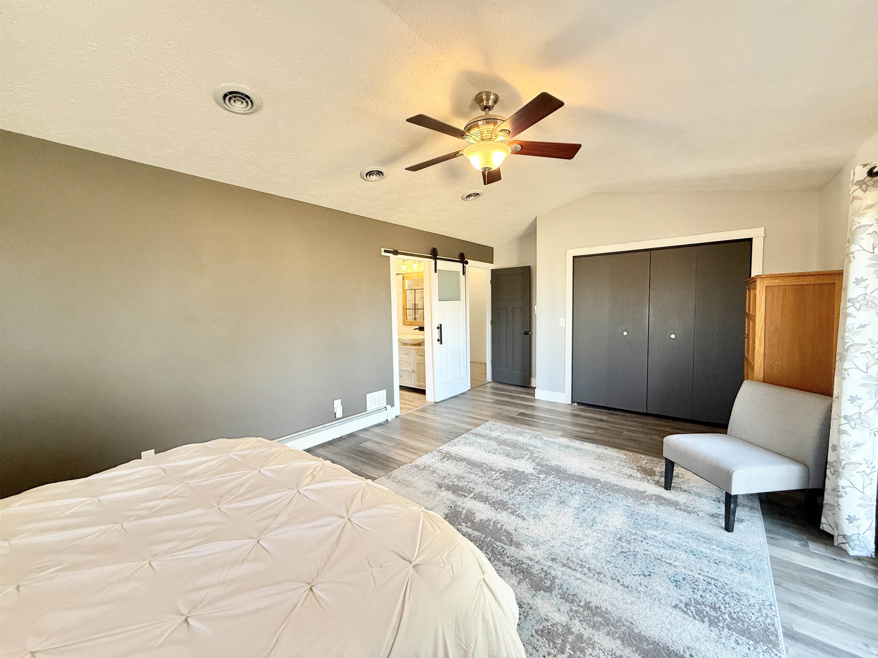 11245 Fox Trail Road Durand, IL 61024 - Photo 20 of 56 a bedroom with a bed and a couch