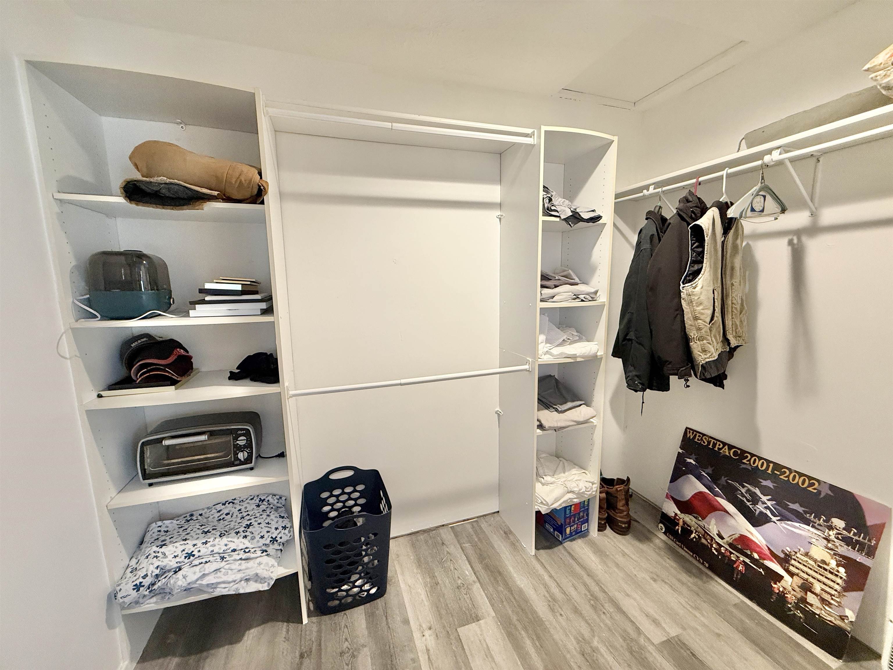 11245 Fox Trail Road Durand, IL 61024 - Photo 22 of 56 a view of walk in closet with clothes and shoes