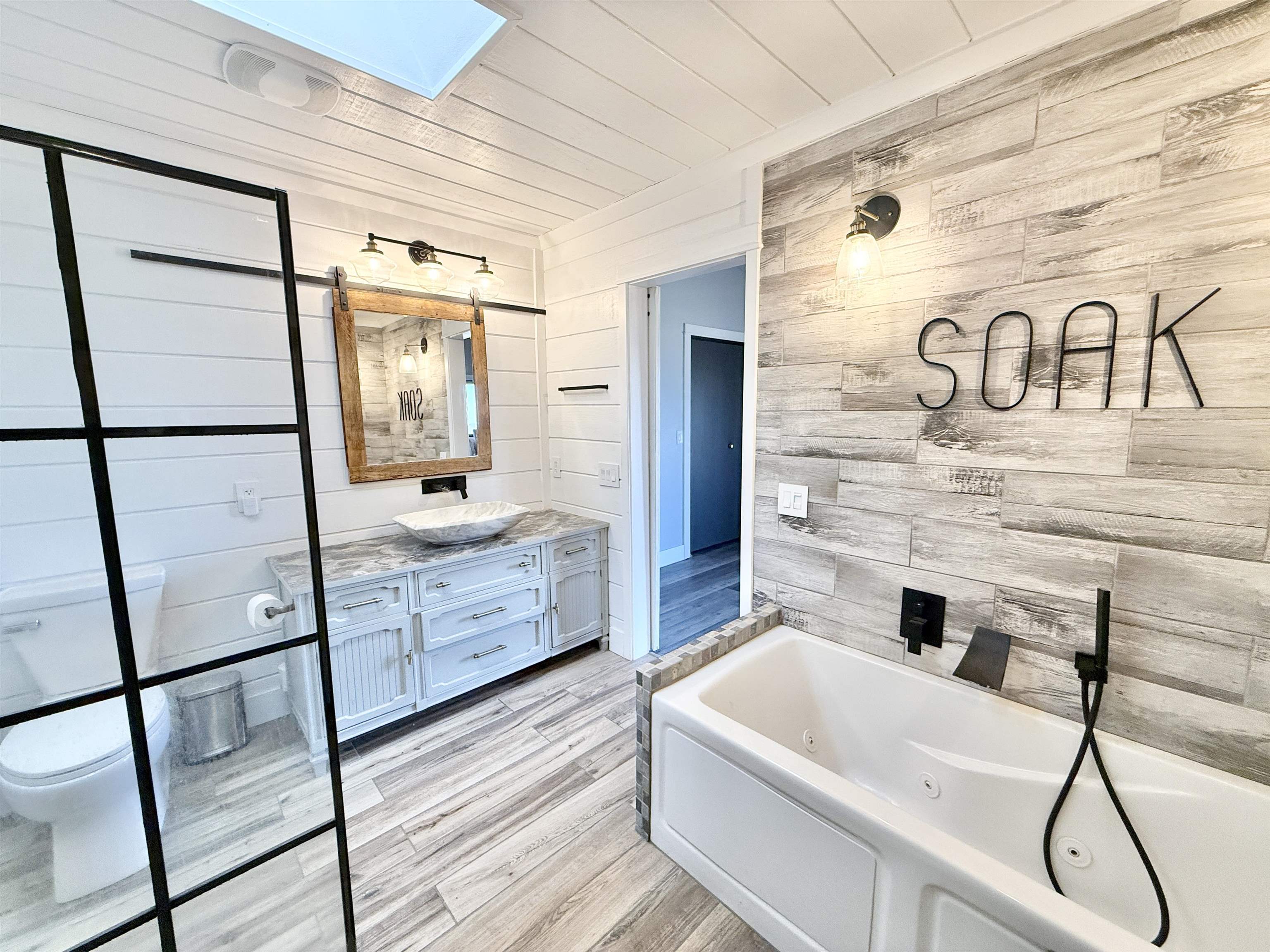 11245 Fox Trail Road Durand, IL 61024 - Photo 24 of 56 a bathroom with a bathtub and a shower