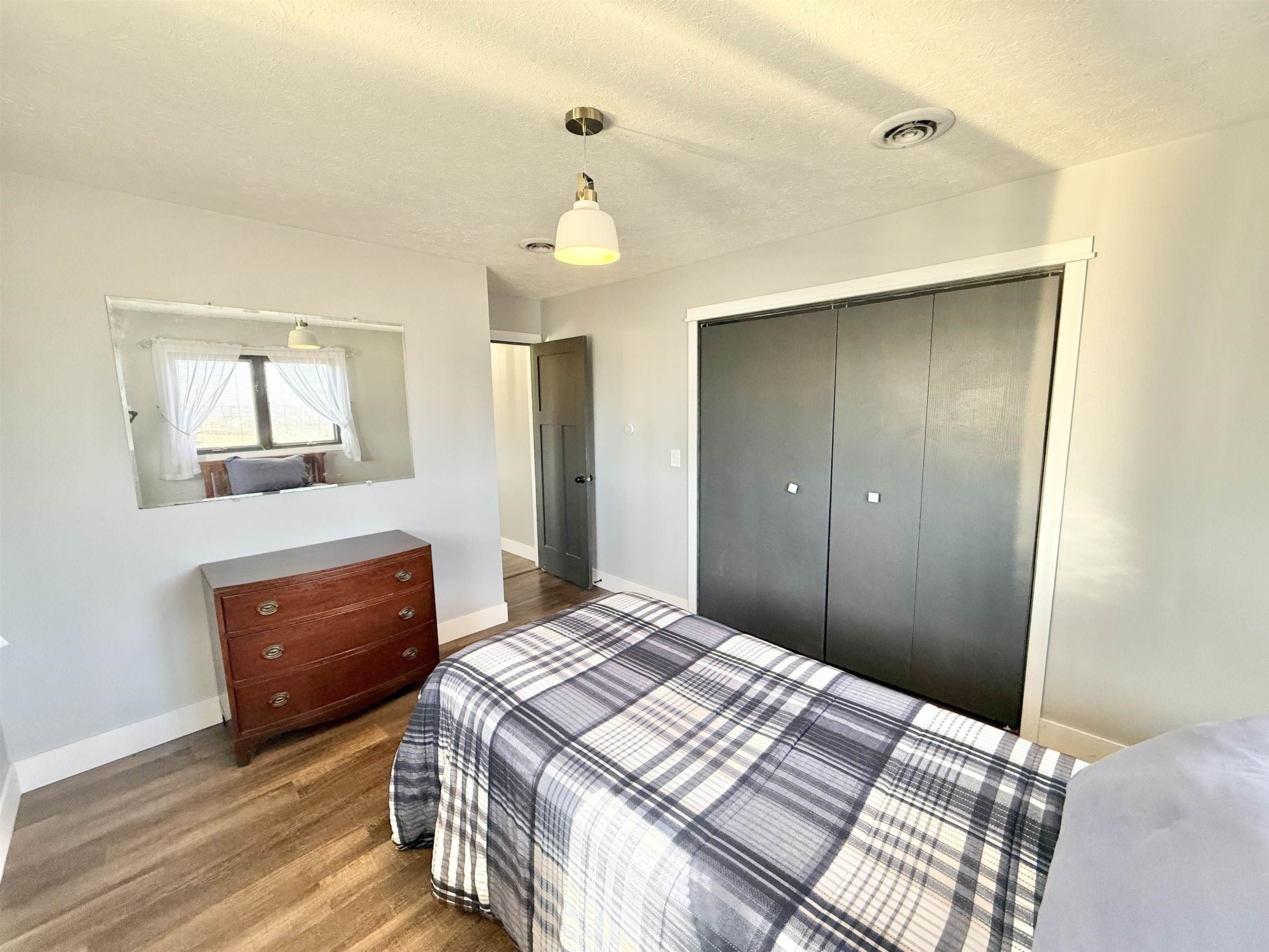 11245 Fox Trail Road Durand, IL 61024 - Photo 31 of 56 a bedroom with a bed and a dresser