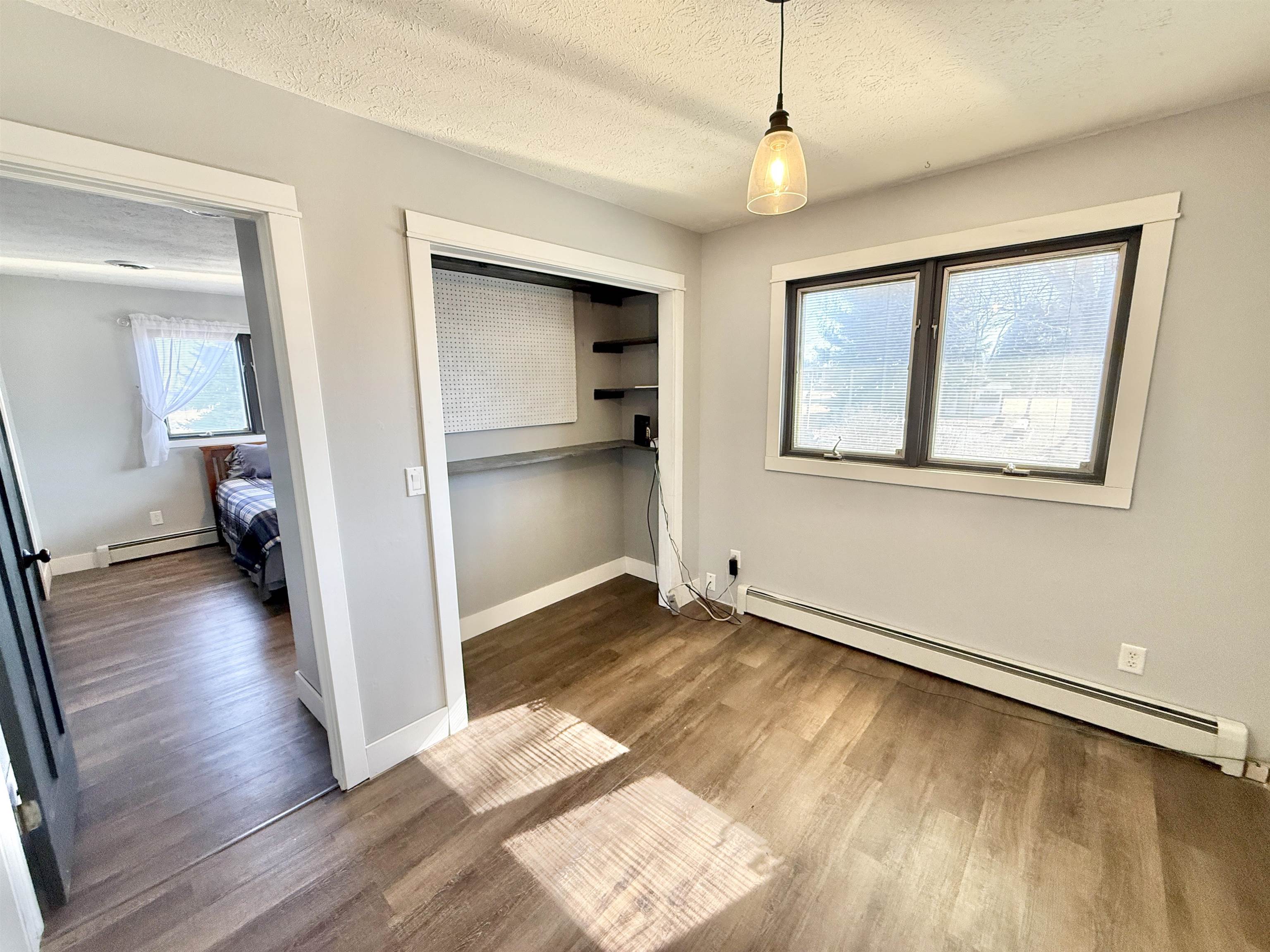 11245 Fox Trail Road Durand, IL 61024 - Photo 32 of 56 a view of livingroom with hardwood floor and a ceiling fan