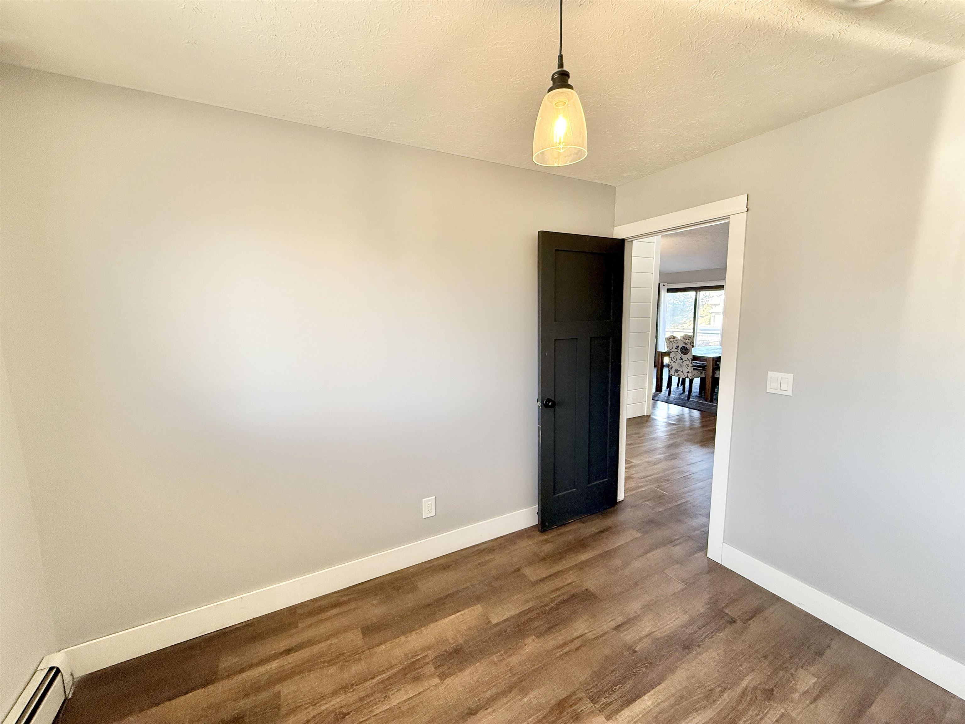 11245 Fox Trail Road Durand, IL 61024 - Photo 33 of 56 a view of a room with wooden floor and a ceiling fan