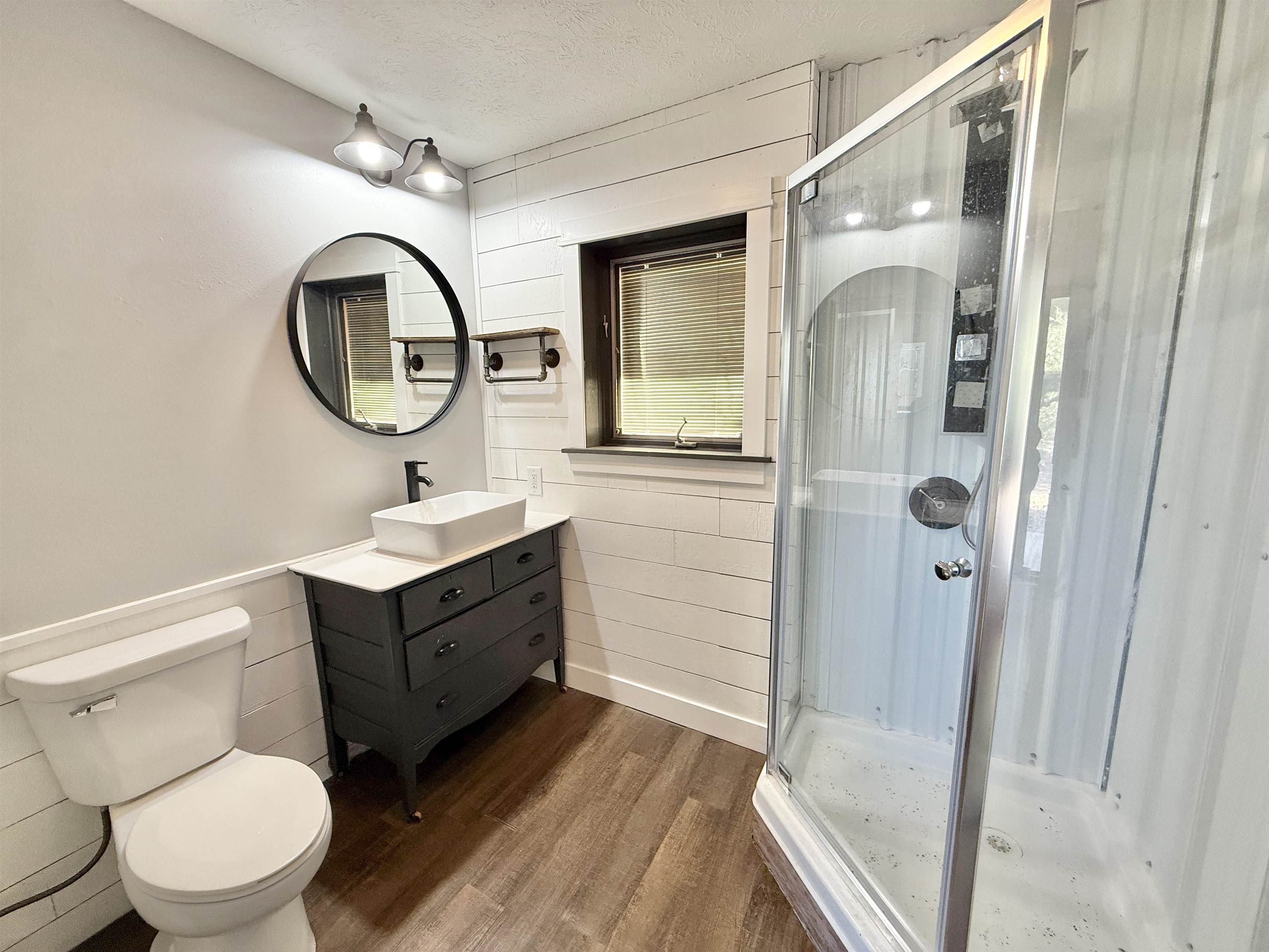 11245 Fox Trail Road Durand, IL 61024 - Photo 44 of 56 a bathroom with a toilet a sink and a mirror