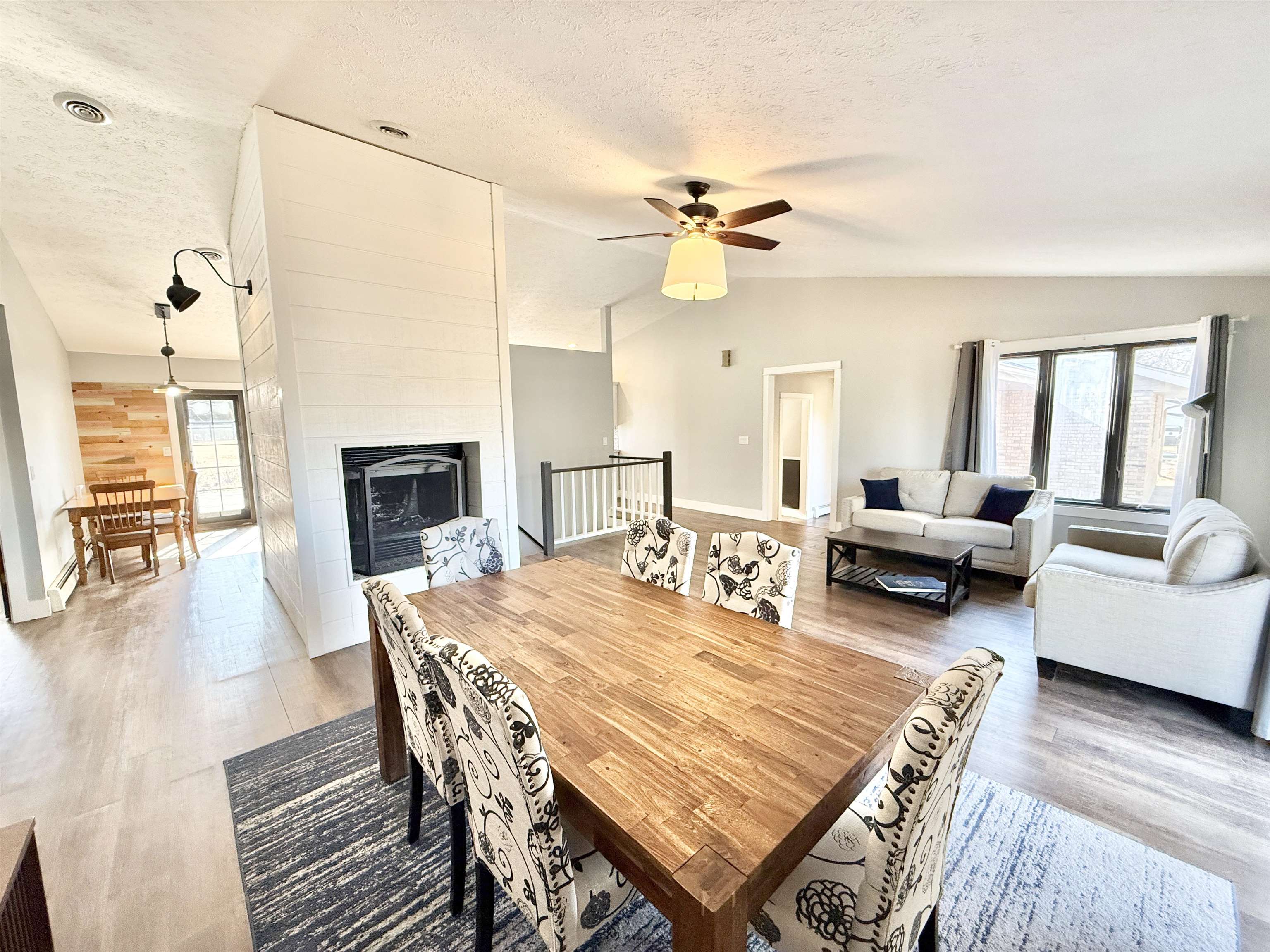 11245 Fox Trail Road Durand, IL 61024 - Photo 7 of 56 a living room with furniture a fireplace and a table