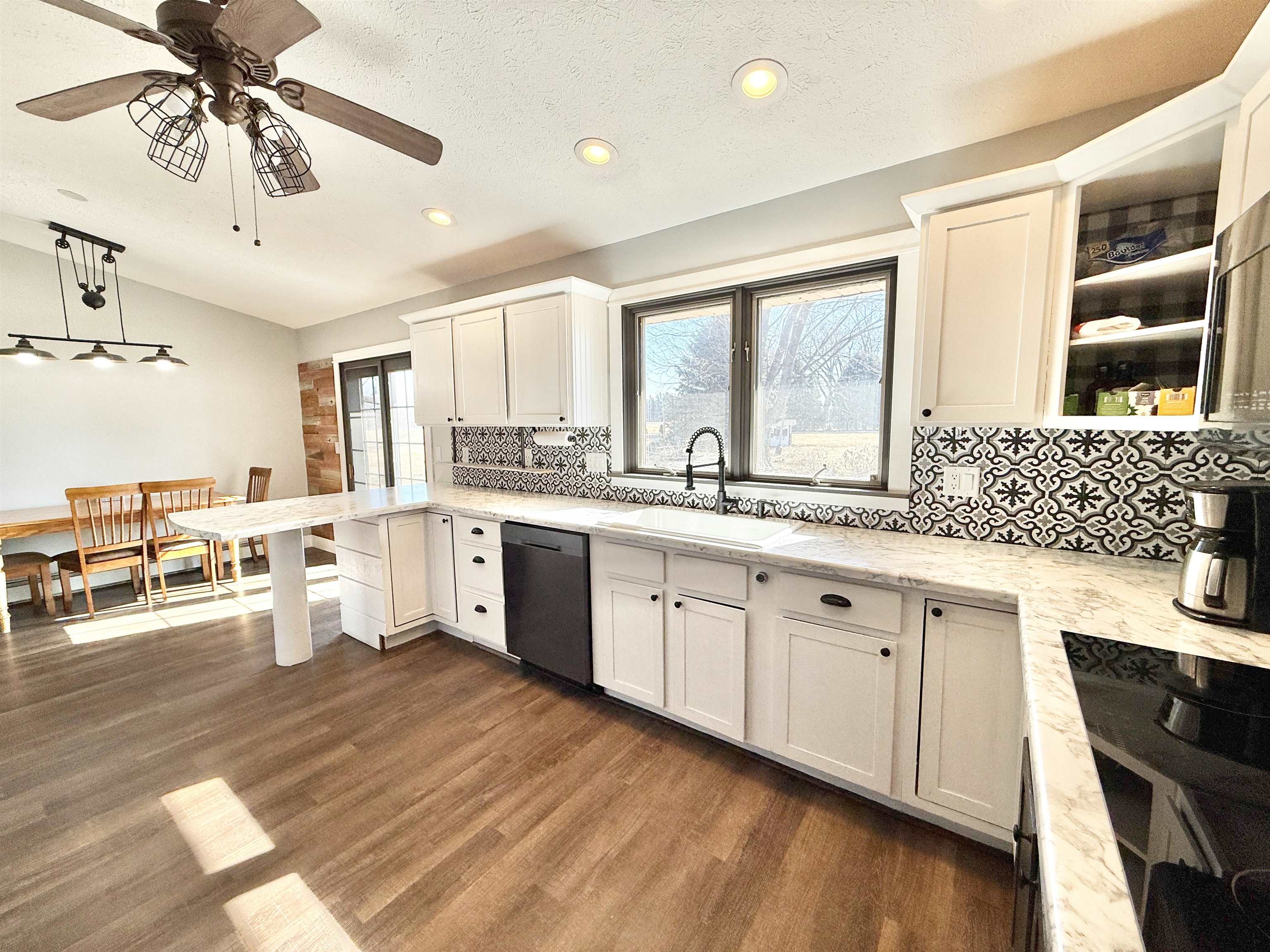 11245 Fox Trail Road Durand, IL 61024 - Photo 9 of 56 a large white kitchen with a large window