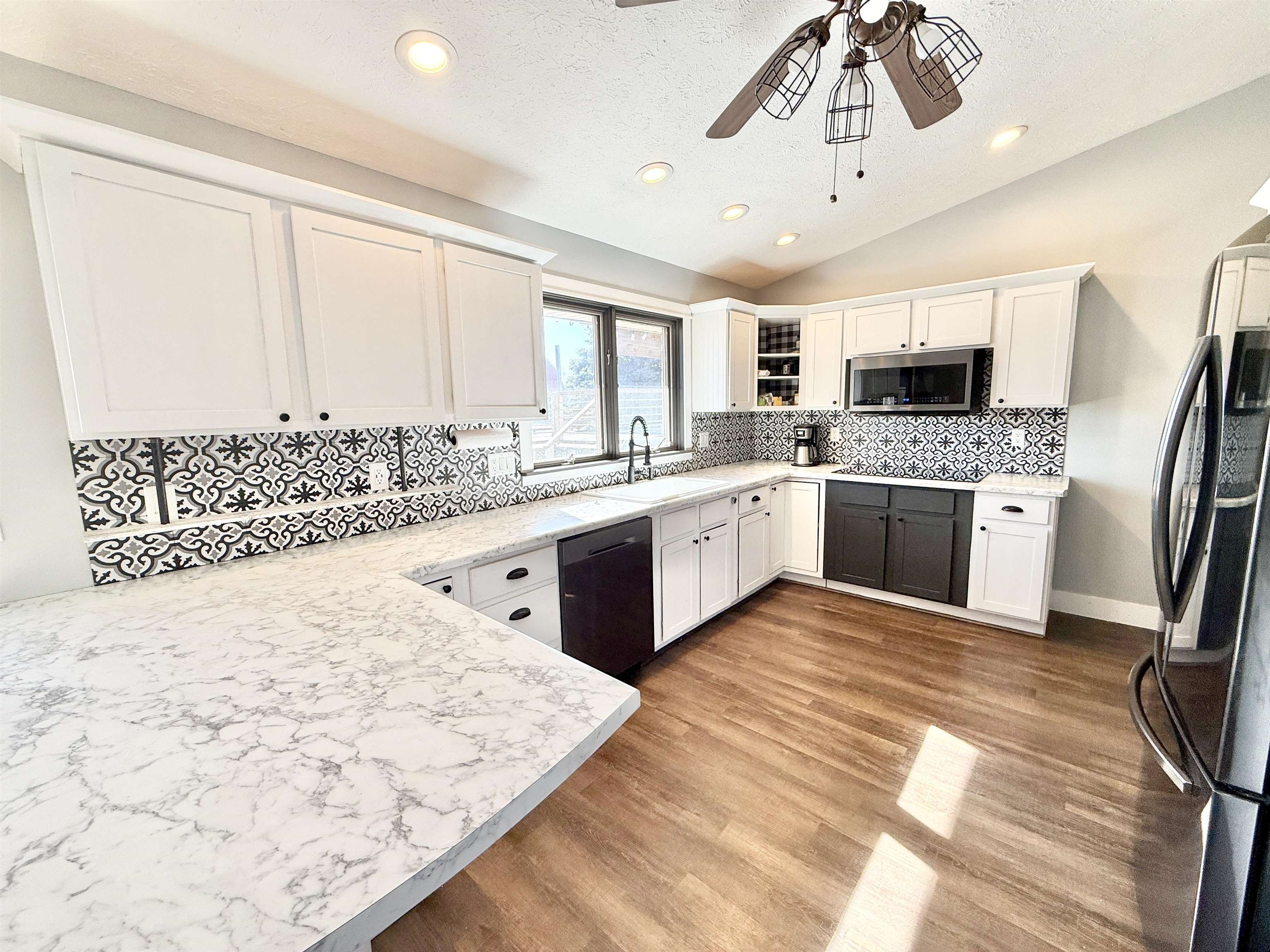 11245 Fox Trail Road Durand, IL 61024 - Photo 10 of 56 a large kitchen with stainless steel appliances kitchen island granite countertop a sink and cabinets