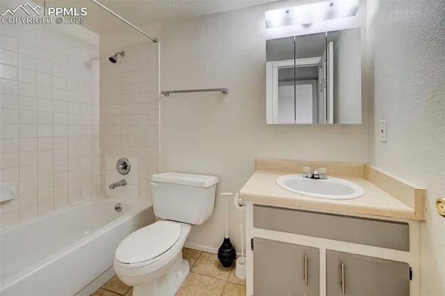 a bathroom with a sink toilet and a bathtub