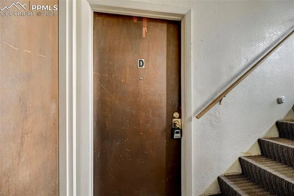 a view of front door with stairs