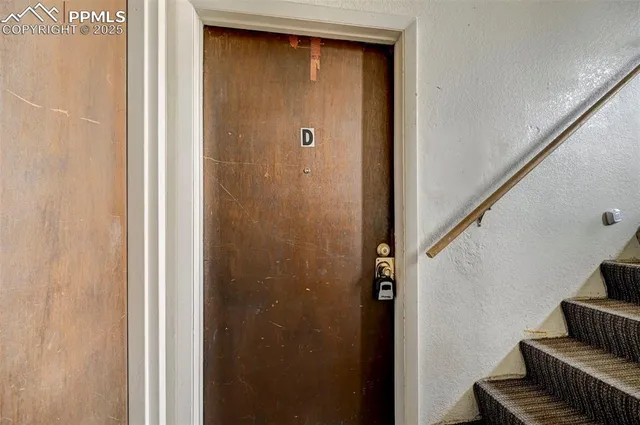 a view of front door with stairs
