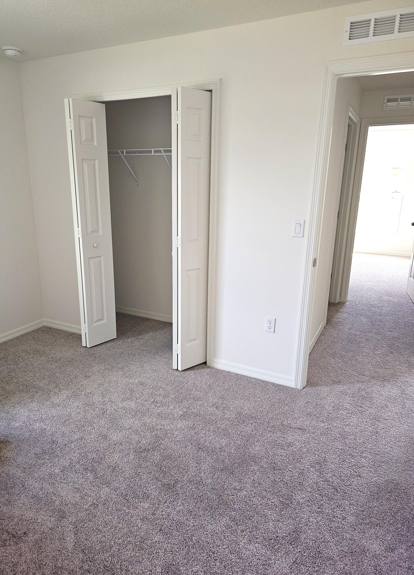 3681 Southwest Haines Street Port St. Lucie, FL 34953 - Photo 19 of 19 an empty room with windows and closet