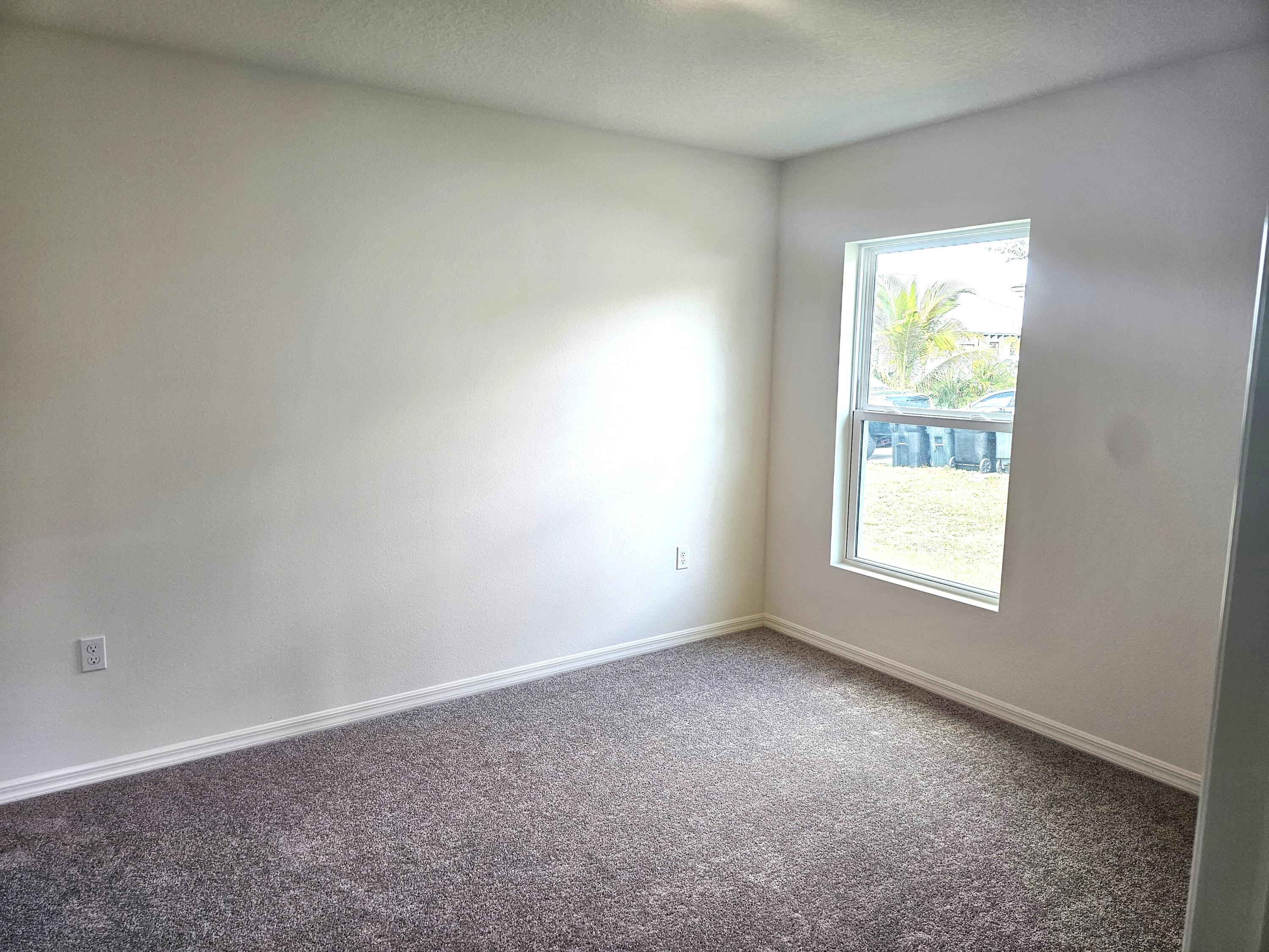 3681 Southwest Haines Street Port St. Lucie, FL 34953 - Photo 8 of 19 an empty room with a window