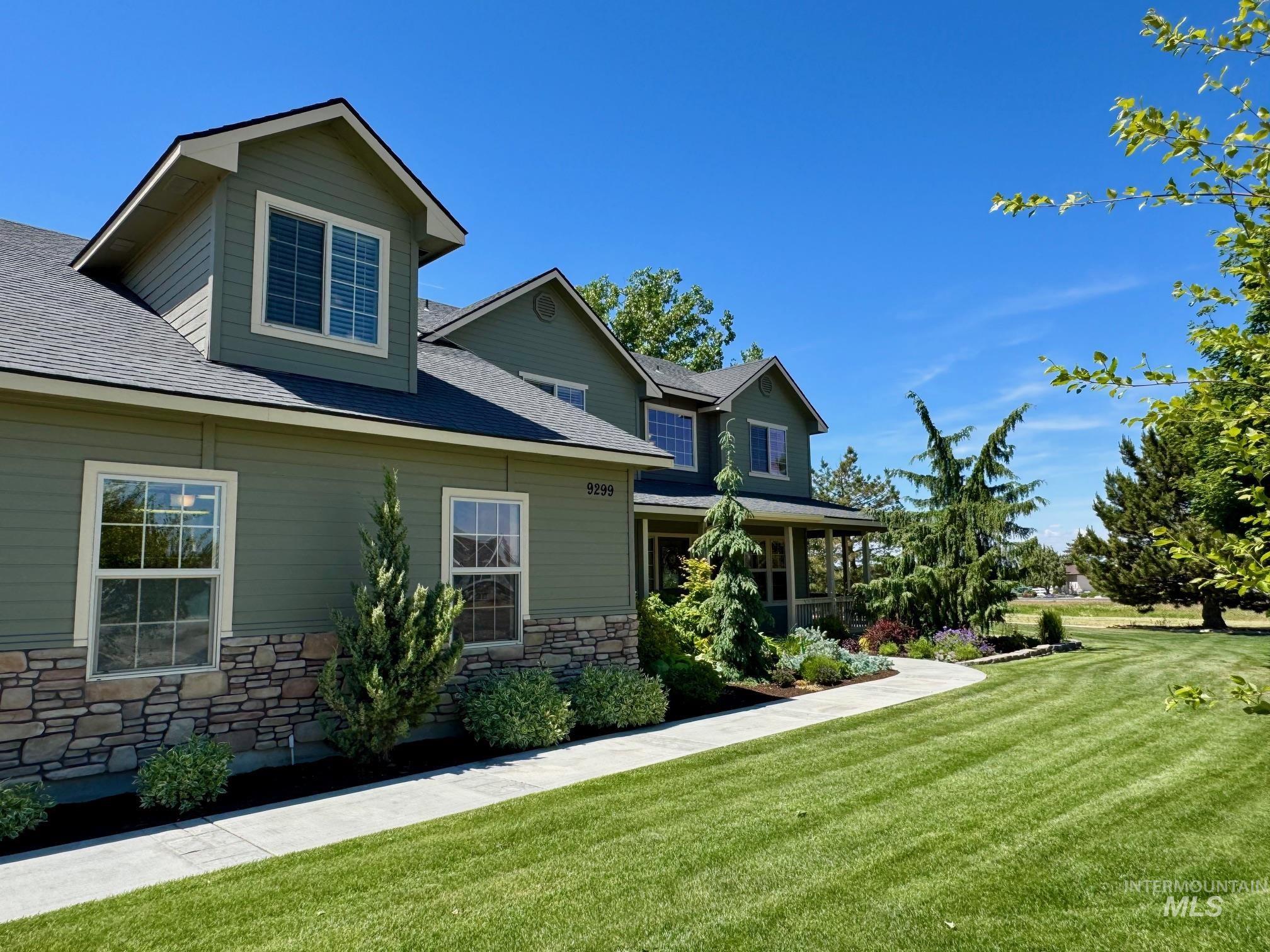 9299 Kemp Road Middleton, ID 83644 - Photo 45 of 50 Two-story residence featuring green siding and stone veneer accents