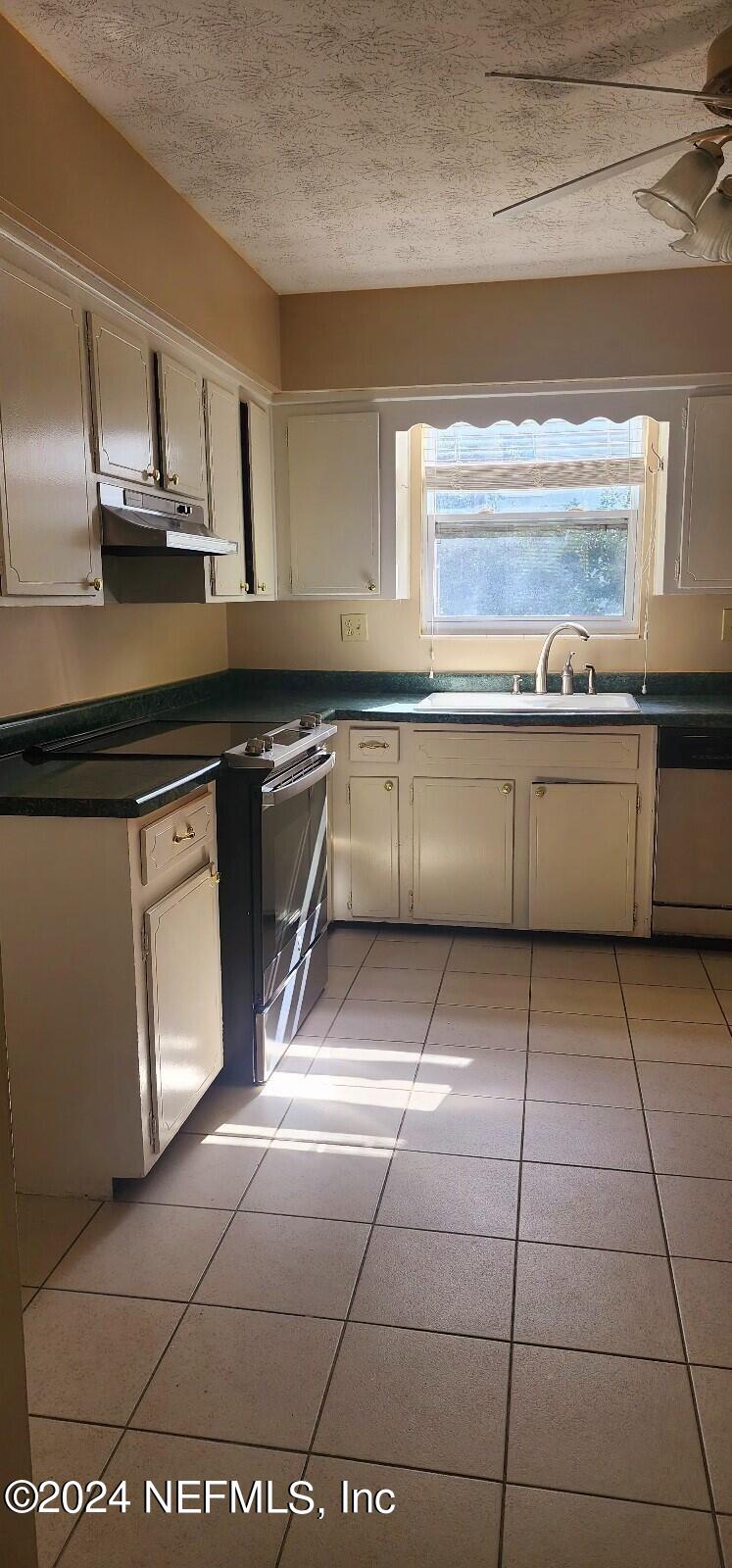 25 Versaggi Drive St. Augustine, FL 32080 - Photo 7 of 23 a kitchen with a sink a stove cabinets and counter space