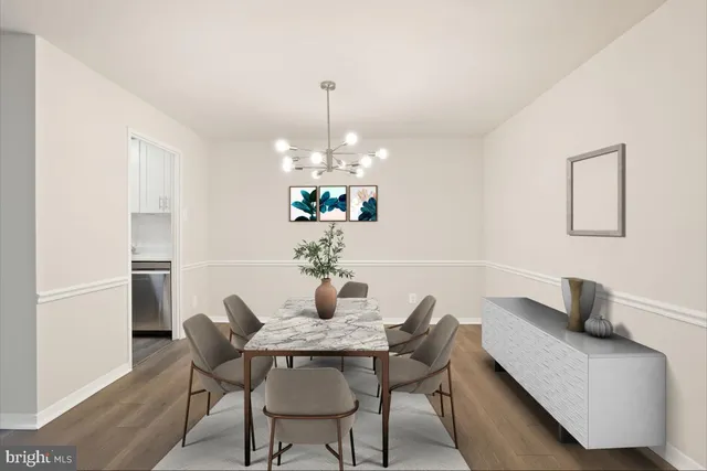 a view of a room with wooden floor and ceiling fan