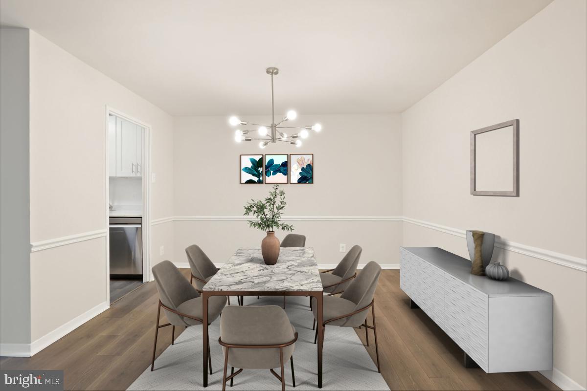 1900 Lyttonsville Road, Unit 216 Silver Spring, MD 20910 - Photo 13 of 38 a dining room with furniture and chandelier