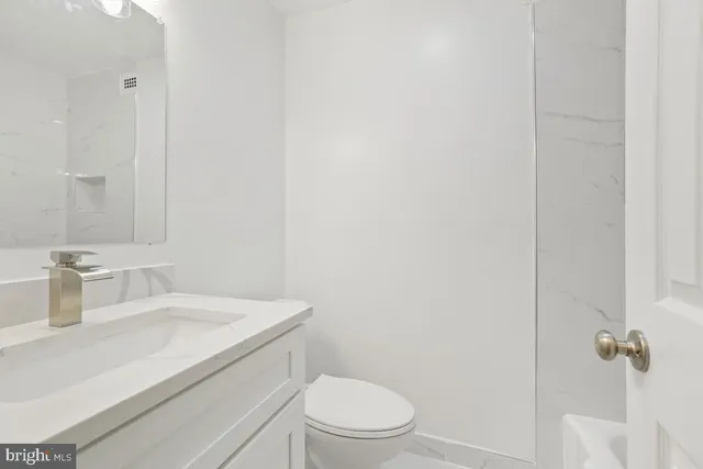 a bathroom with a sink and a bathtub