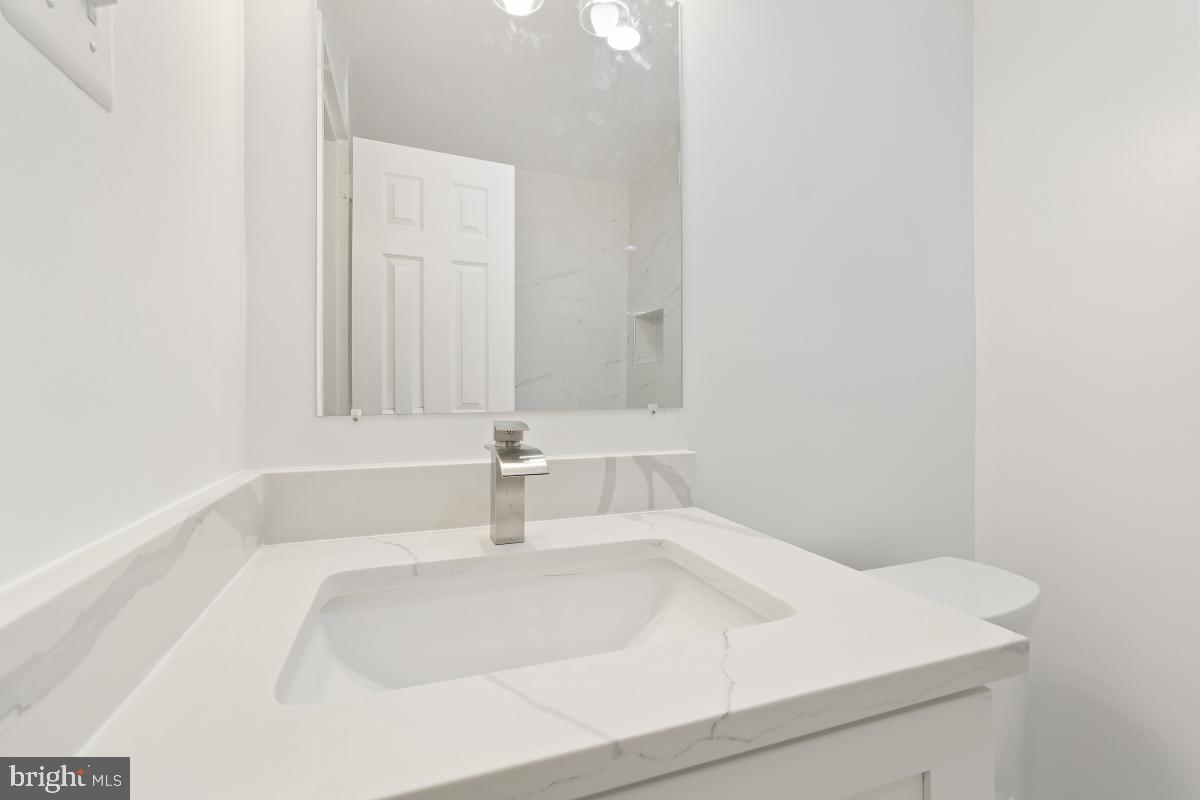 1900 Lyttonsville Road, Unit 216 Silver Spring, MD 20910 - Photo 20 of 38 a bathroom with a sink and a bathtub
