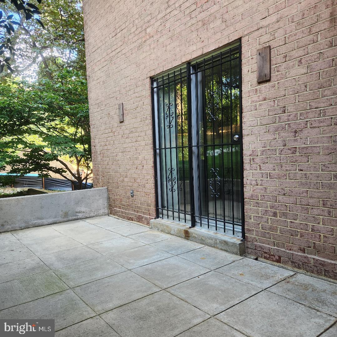 1900 Lyttonsville Road, Unit 216 Silver Spring, MD 20910 - Photo 25 of 38 a view of outdoor space with sliding door