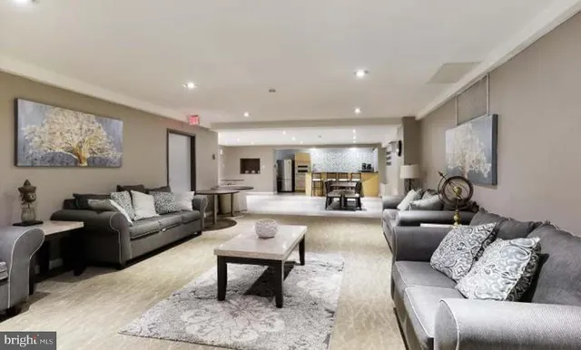 a view of a livingroom with furniture and an empty room