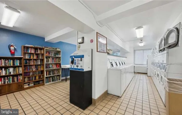 a kitchen with cabinets and stainless steel appliances