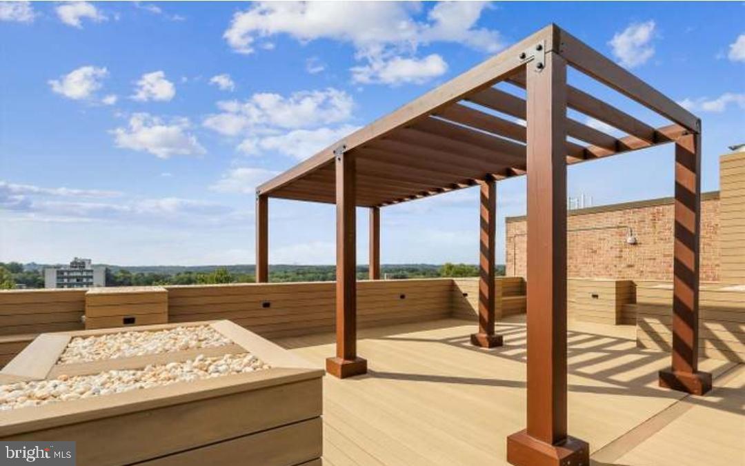 1900 Lyttonsville Road, Unit 216 Silver Spring, MD 20910 - Photo 35 of 38 a view of terrace with wooden floor and city view
