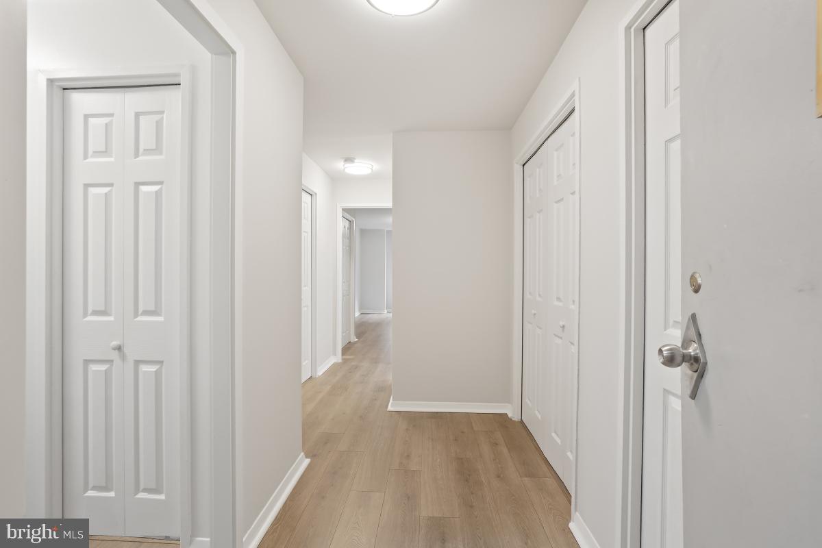 1900 Lyttonsville Road, Unit 216 Silver Spring, MD 20910 - Photo 4 of 38 a view of a room with wooden floor