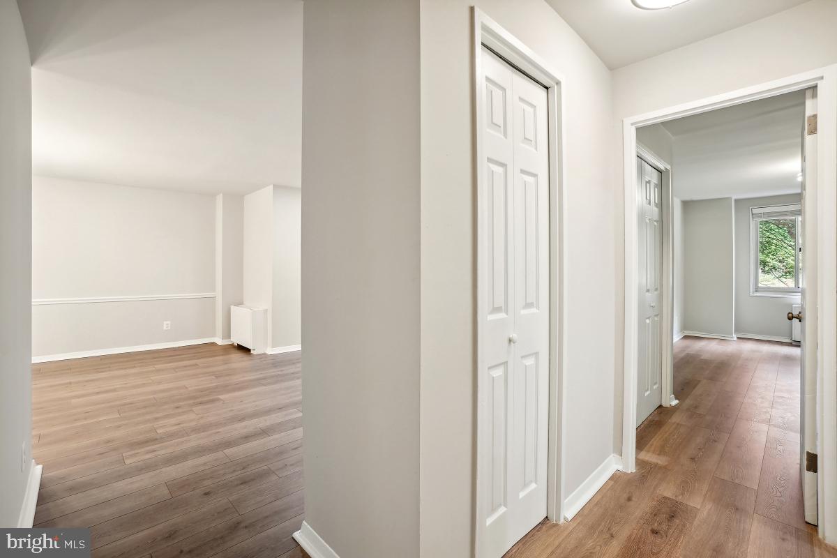 1900 Lyttonsville Road, Unit 216 Silver Spring, MD 20910 - Photo 5 of 38 a view of a hallway with wooden floor