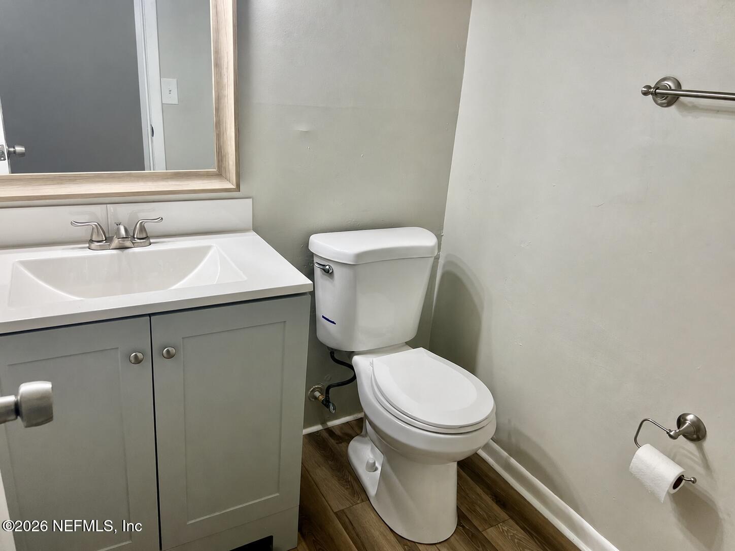 10964 Bacall Road West Jacksonville, FL 32218 - Photo 11 of 19 a white toilet sitting next to a bathroom sink