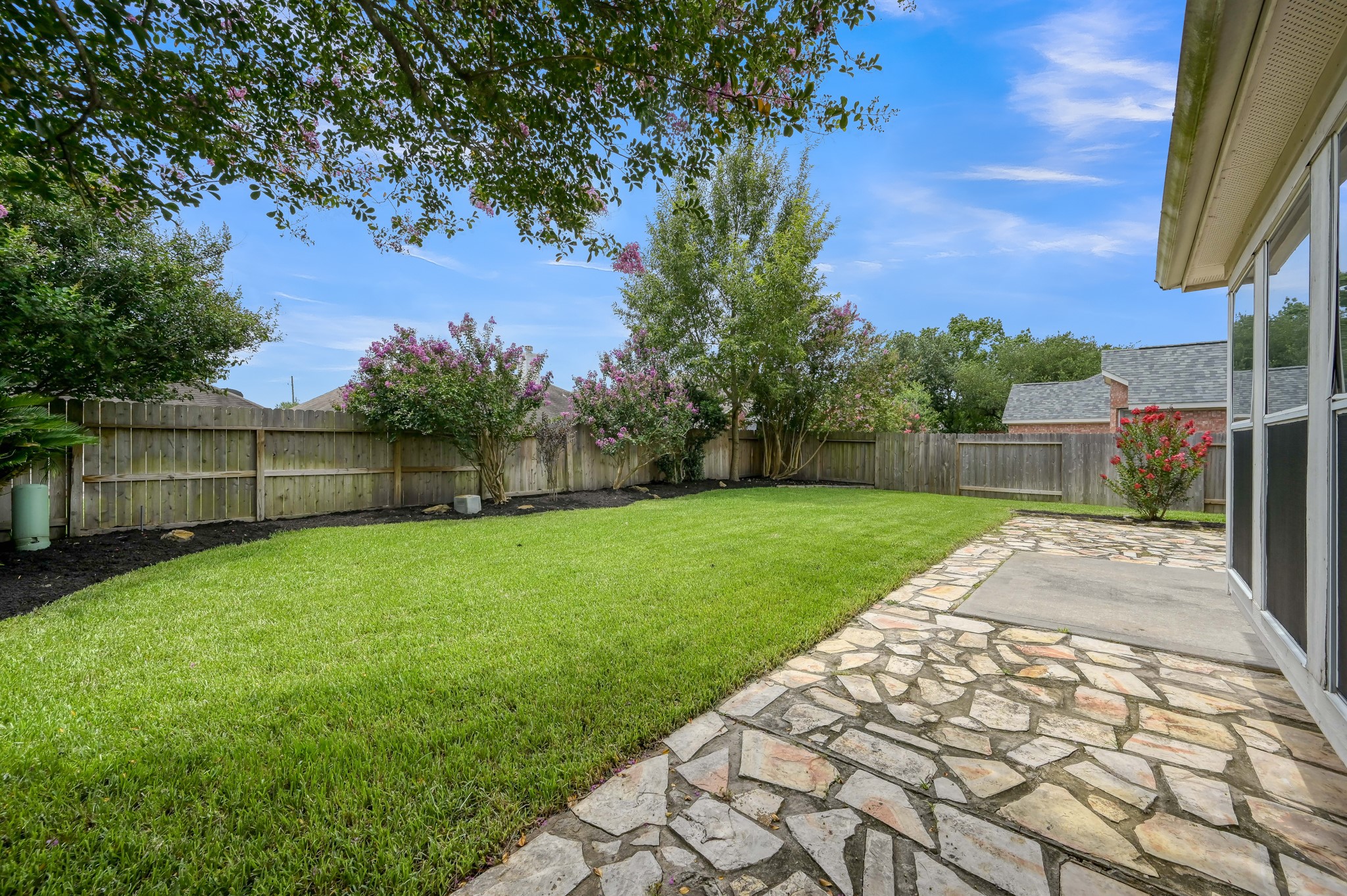 21331 Timber Pines Drive Spring, TX 77388 - Photo 20 of 22 Step outside onto this fabulous flagstone patio area! Dine al fresco under the evening sky, or spend an afternoon just enjoying nature!
