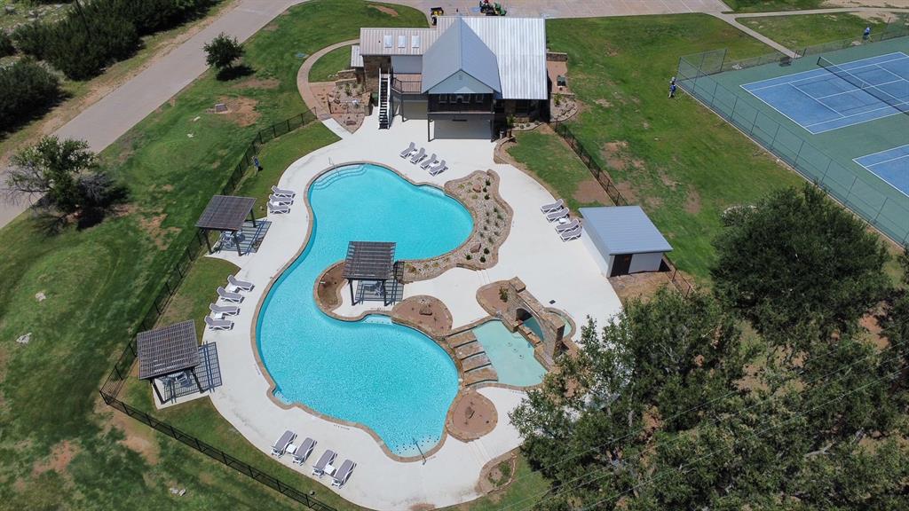 30 Neeleys Slough Graford, TX 76449 - Photo 4 of 11 an aerial view of a house with outdoor space and swimming pool