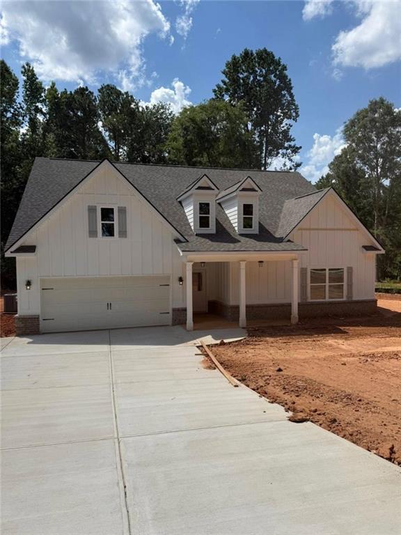 411 Elwyn Barrett Road Jefferson, GA 30549 - Photo 1 of 1 a front view of a house with a yard