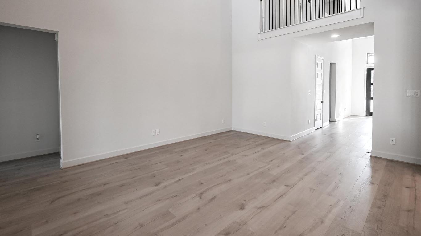 523 Prickly Poppy Loop Kyle, TX 78640 - Photo 21 of 40 Spare room featuring light wood-type flooring and a towering ceiling