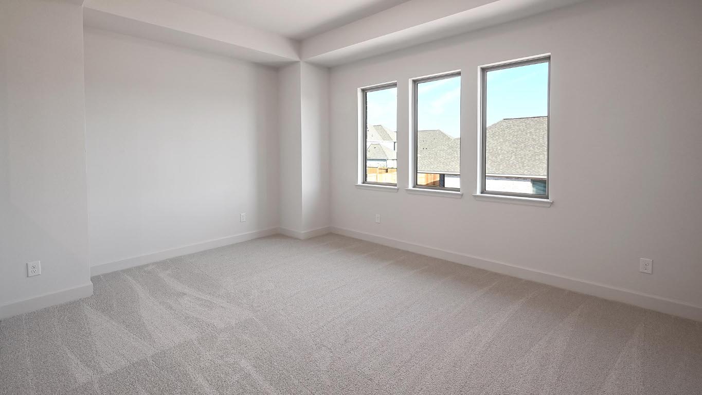 523 Prickly Poppy Loop Kyle, TX 78640 - Photo 23 of 40 Spare room with light colored carpet and baseboards