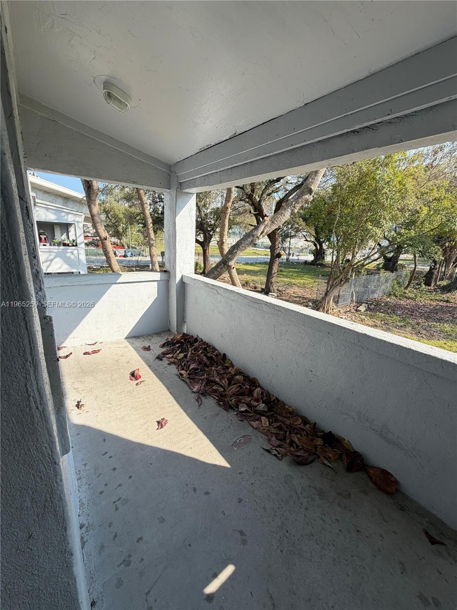 140 Northwest 13th Street, Unit 154 Miami, FL 33136 - Photo 3 of 18 wooden floor with a window