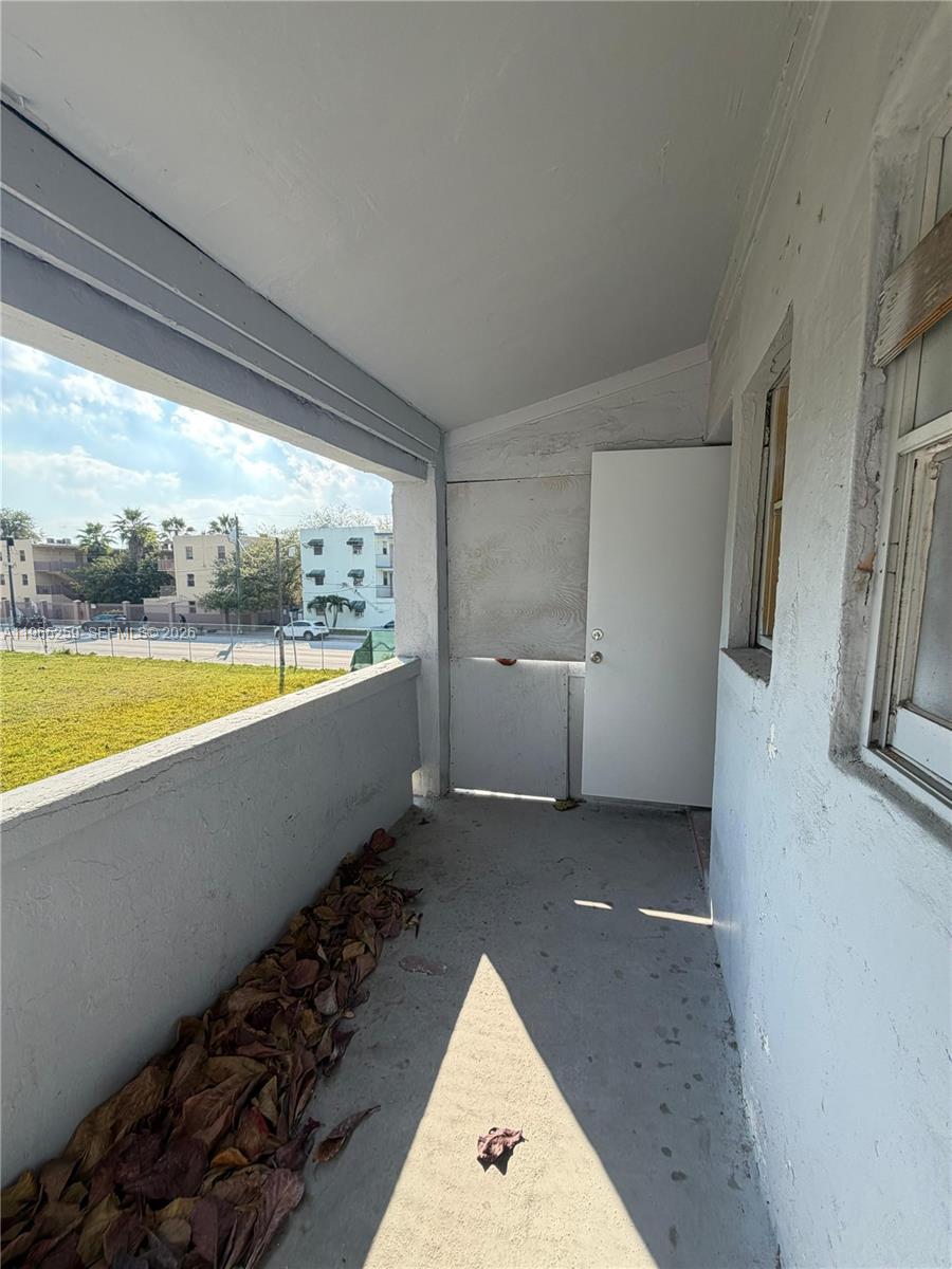 140 Northwest 13th Street, Unit 154 Miami, FL 33136 - Photo 4 of 18 a view of an empty room and window