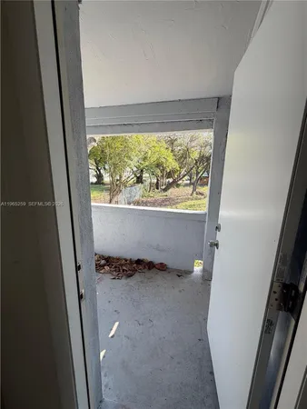 a view of outdoor space with wooden floor