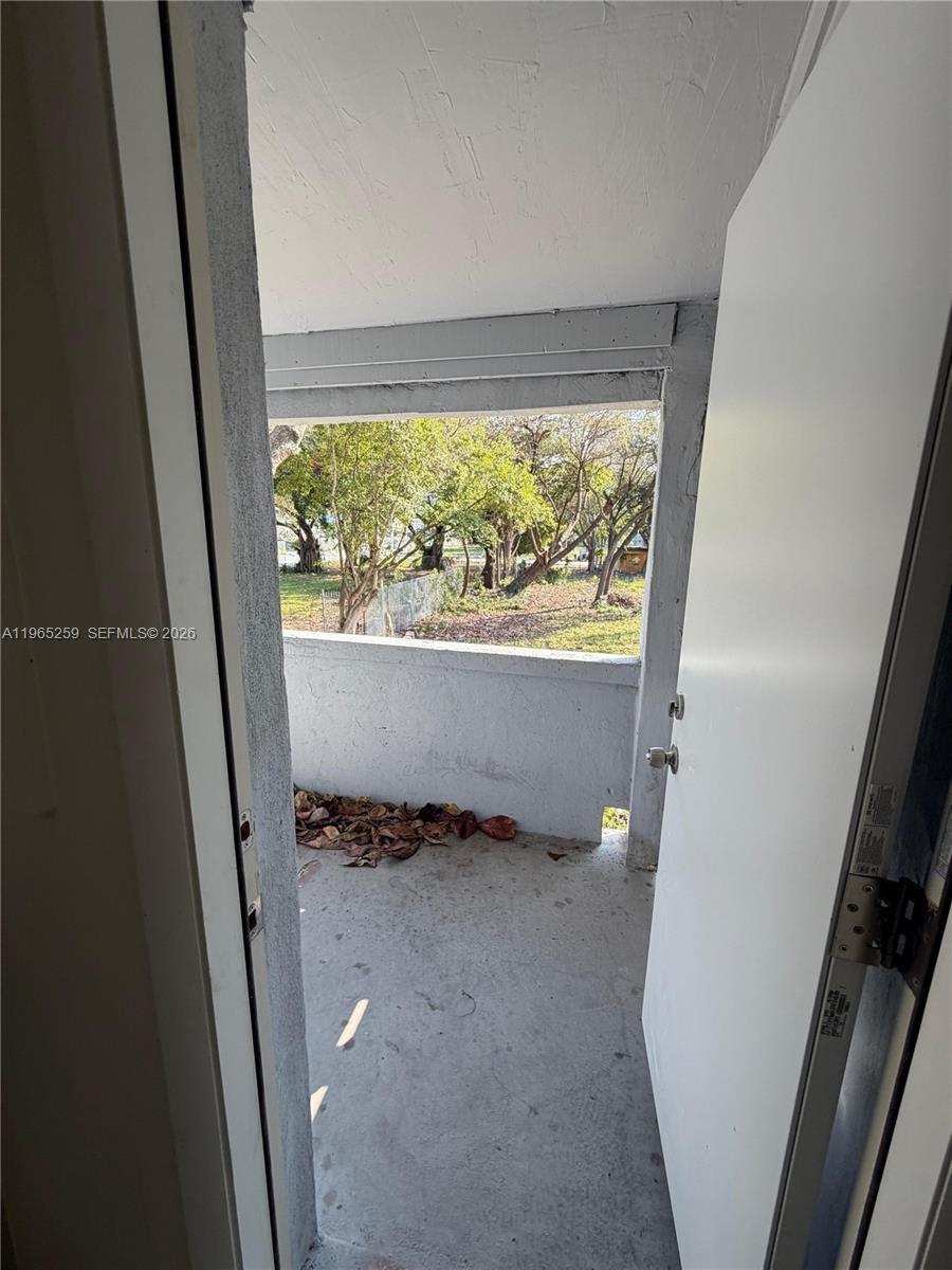 140 Northwest 13th Street, Unit 154 Miami, FL 33136 - Photo 5 of 18 a view of outdoor space with wooden floor
