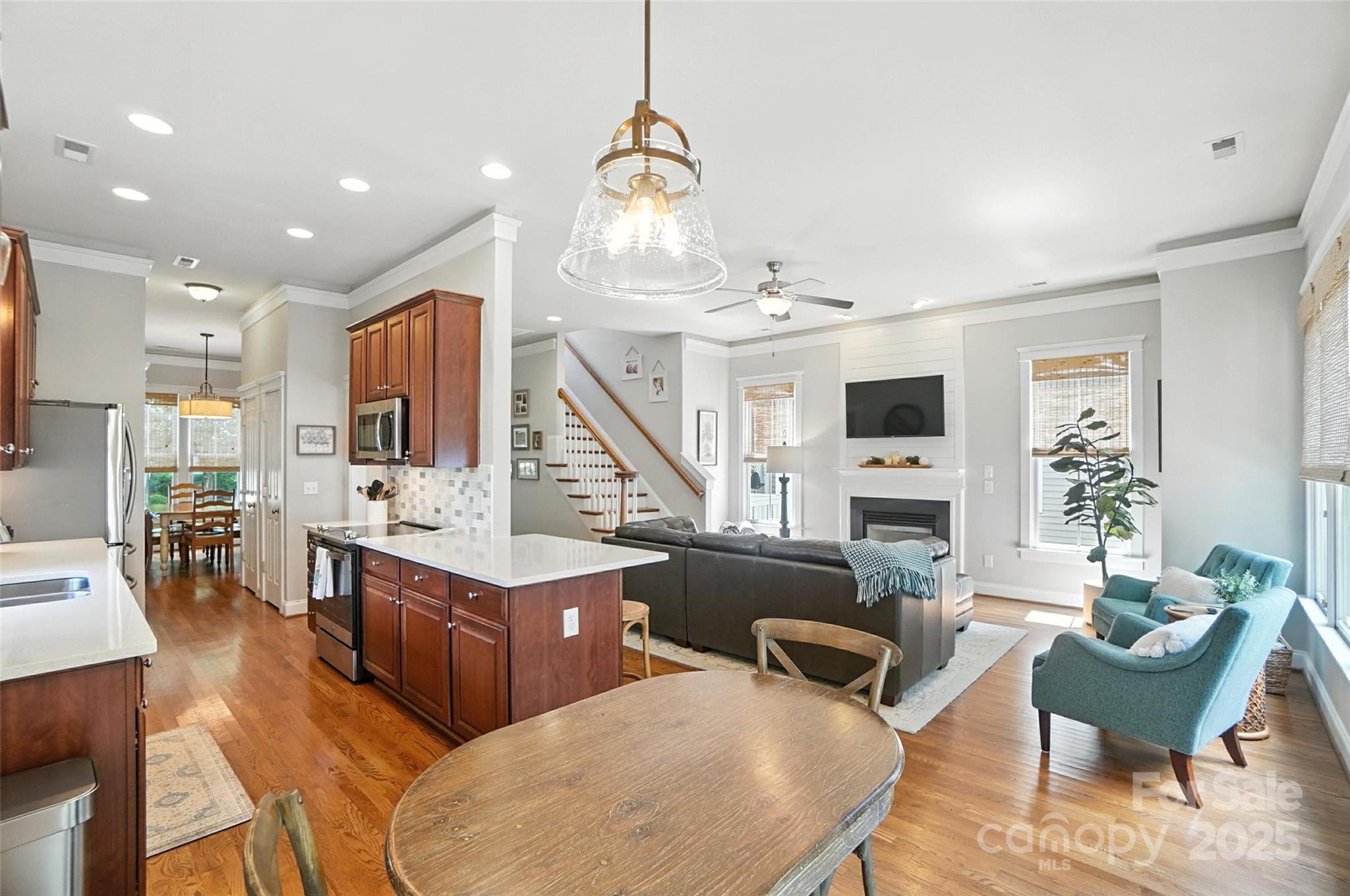 3281 Richard's Crossing Fort Mill, SC 29708 - Photo 19 of 48 a living room with furniture kitchen view and a chandelier