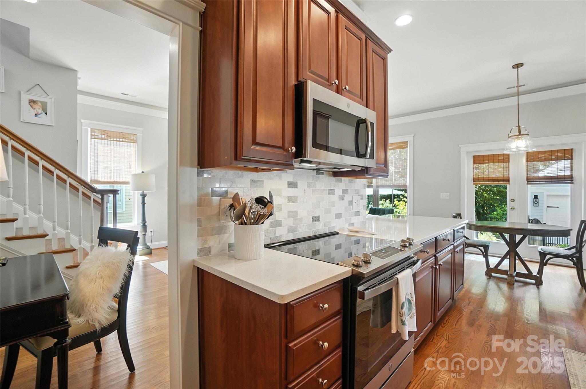 3281 Richard's Crossing Fort Mill, SC 29708 - Photo 23 of 48 a kitchen with stainless steel appliances granite countertop a stove a sink and a microwave